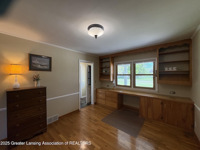 108 S Center St, Eaton Rapids, MI 48827 - unfurnished office featuring crown molding, light wood finished floors, and baseboards