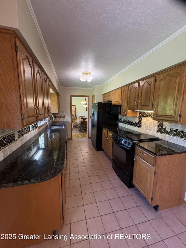 108 S Center St, Eaton Rapids, MI 48827 - kitchen with black appliances, a sink, light tile patterned floors, backsplash, and a textured ceiling
