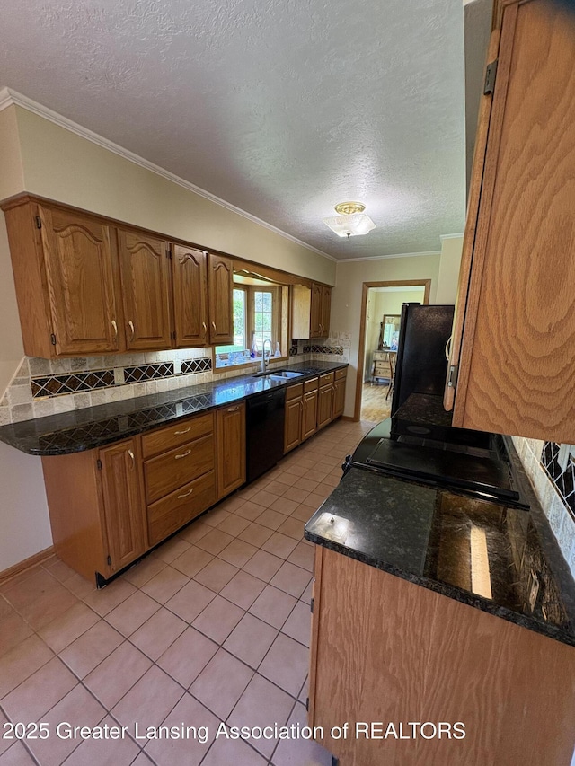108 S Center St, Eaton Rapids, MI 48827 - kitchen featuring black appliances, a sink, ornamental molding, a textured ceiling, and light tile patterned floors