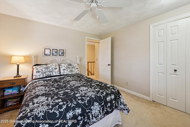 bedroom featuring carpet, baseboards, a closet, and ceiling fan