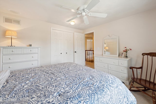 bedroom featuring carpet, ceiling fan, and a closet