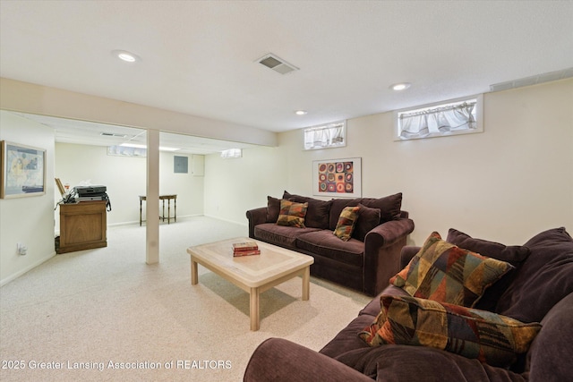 living room with light colored carpet, recessed lighting, and baseboards
