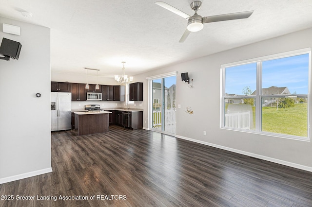 6669 Cotswald Dr Unit 126, Grand Ledge, MI 48837 - kitchen featuring stainless steel appliances, a center island, dark brown cabinets, and baseboards