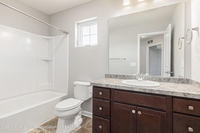 6669 Cotswald Dr Unit 126, Grand Ledge, MI 48837 - full bathroom with toilet, vanity, baseboards, and bathing tub / shower combination