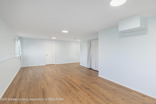 6669 Cotswald Dr Unit 126, Grand Ledge, MI 48837 - spare room with recessed lighting, wood finished floors, and baseboards