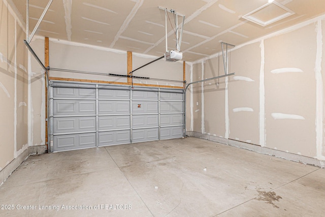 6669 Cotswald Dr Unit 126, Grand Ledge, MI 48837 - garage featuring a garage door opener
