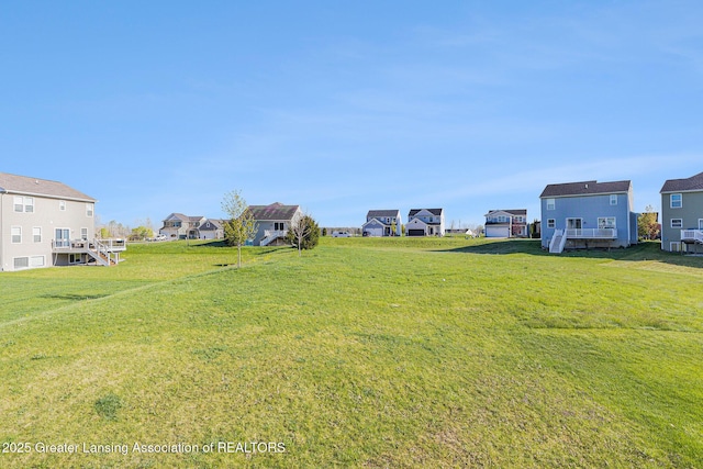6669 Cotswald Dr Unit 126, Grand Ledge, MI 48837 - view of yard featuring a residential view