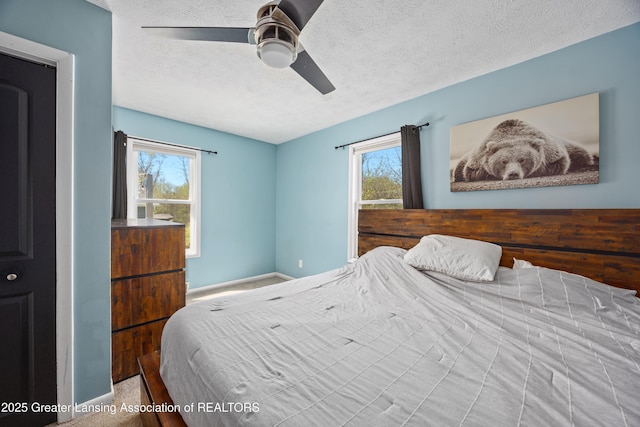 5364 Drumheller Rd, Bath, MI 48808 - carpeted bedroom with a textured ceiling, baseboards, multiple windows, and ceiling fan