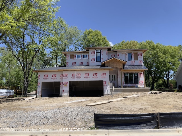6120 Fresno Ln, East Lansing, MI 48823 - property in mid-construction featuring a garage