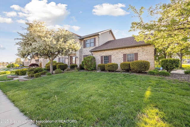 900 Oneida Woods Trl, Grand Ledge, MI 48837 - view of front facade featuring a front lawn and brick siding
