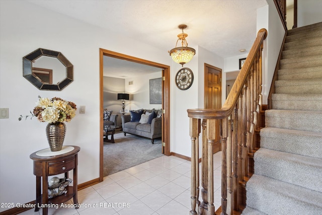 900 Oneida Woods Trl, Grand Ledge, MI 48837 - stairs with carpet flooring, tile patterned flooring, and baseboards