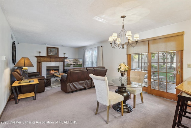 900 Oneida Woods Trl, Grand Ledge, MI 48837 - carpeted dining area with a chandelier and a tile fireplace