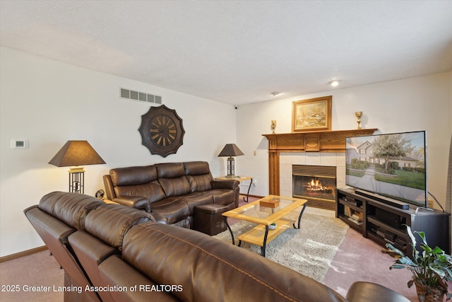 900 Oneida Woods Trl, Grand Ledge, MI 48837 - carpeted living area featuring a tiled fireplace and baseboards