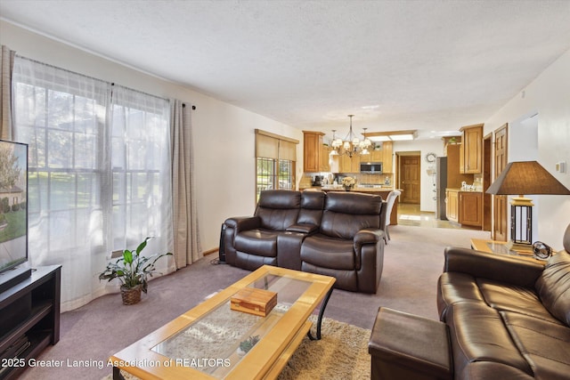 900 Oneida Woods Trl, Grand Ledge, MI 48837 - living area with a chandelier, light colored carpet, and a textured ceiling