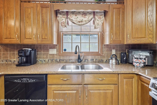 900 Oneida Woods Trl, Grand Ledge, MI 48837 - kitchen with black dishwasher, a sink, tasteful backsplash, and light stone counters