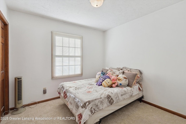 900 Oneida Woods Trl, Grand Ledge, MI 48837 - carpeted bedroom featuring a textured ceiling and baseboards
