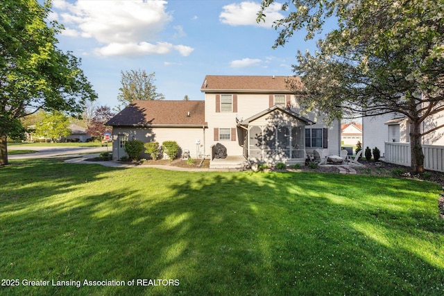 900 Oneida Woods Trl, Grand Ledge, MI 48837 - rear view of house featuring a patio and a sunroom