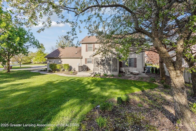 900 Oneida Woods Trl, Grand Ledge, MI 48837 - rear view of property with a yard, a sunroom, and a shingled roof