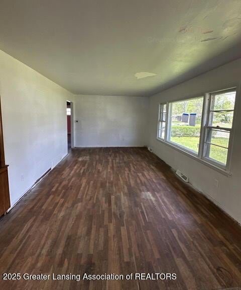 2623 Lafayette Ave, Lansing, MI 48906 - unfurnished living room with dark wood finished floors