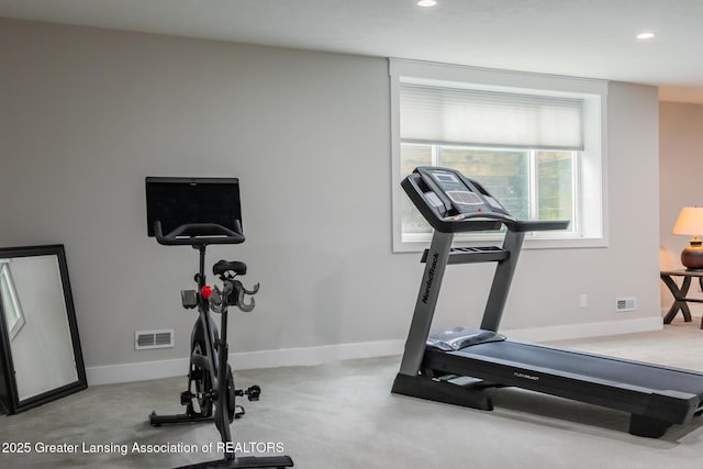 workout room with recessed lighting and baseboards