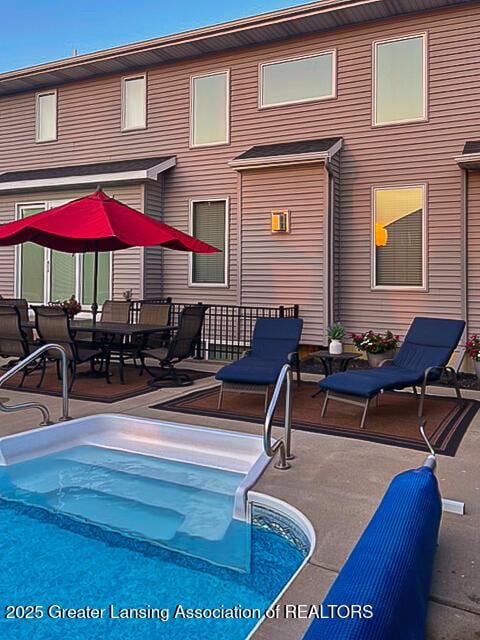 swimming pool with a patio area