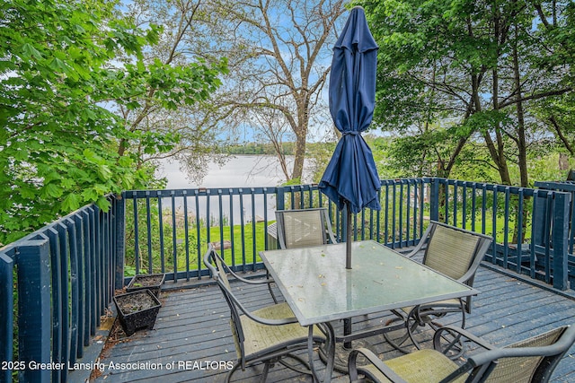 15496 Park Lake Rd, East Lansing, MI 48823 - wooden deck with outdoor dining space and a water view