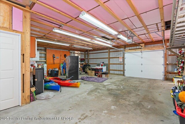 607 Ogemaw St, Grayling, MI 49738 - garage featuring a garage door opener