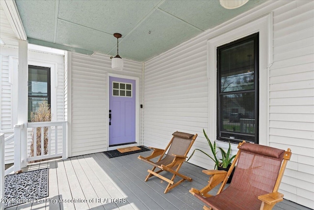 607 Ogemaw St, Grayling, MI 49738 - wooden terrace with covered porch