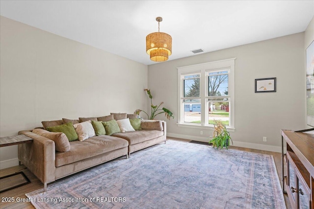607 Ogemaw St, Grayling, MI 49738 - living area featuring baseboards and wood finished floors