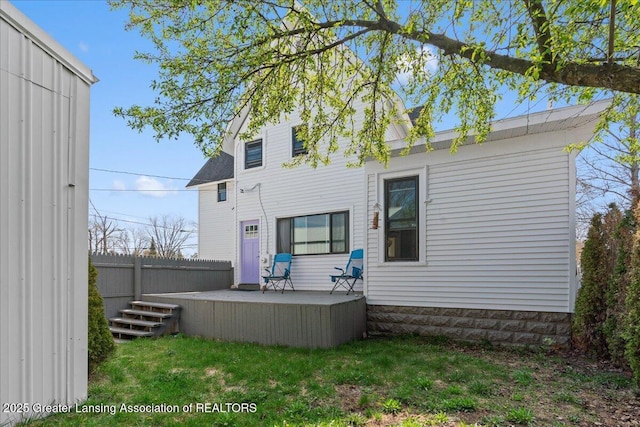607 Ogemaw St, Grayling, MI 49738 - rear view of property featuring a wooden deck and fence