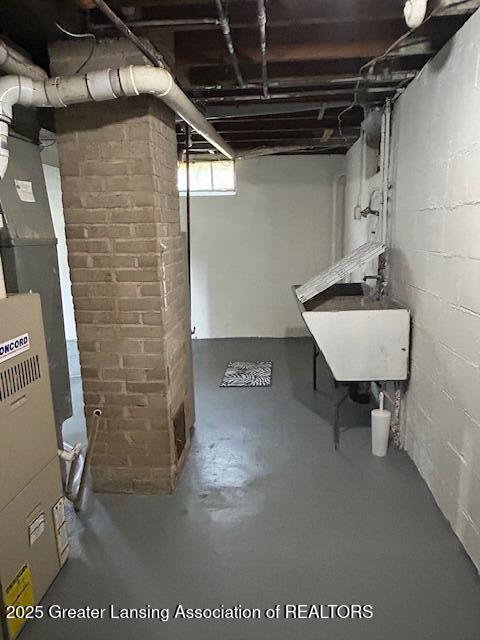 1209 Hapeman St, Lansing, MI 48915 - below grade area featuring a sink and heating unit