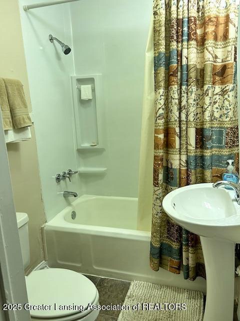 1209 Hapeman St, Lansing, MI 48915 - full bath with tile patterned flooring, shower / tub combo, and toilet