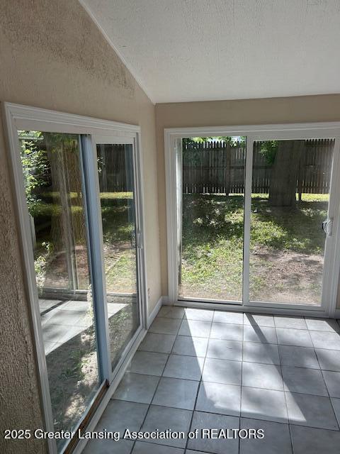 1209 Hapeman St, Lansing, MI 48915 - unfurnished sunroom featuring lofted ceiling