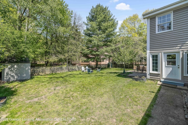 2038 Woodfield Rd, Okemos, MI 48864 - view of yard featuring a storage shed and an outdoor structure