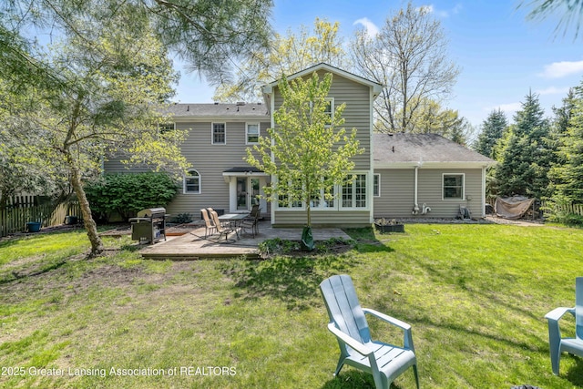 2038 Woodfield Rd, Okemos, MI 48864 - rear view of property featuring a patio area and roof with shingles
