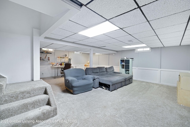 2038 Woodfield Rd, Okemos, MI 48864 - living area with carpet flooring, a paneled ceiling, and a decorative wall