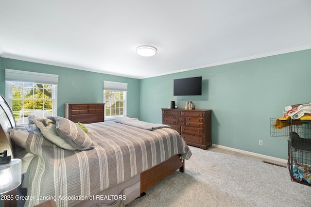 2038 Woodfield Rd, Okemos, MI 48864 - bedroom featuring multiple windows, carpet, ornamental molding, and baseboards