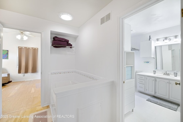 2038 Woodfield Rd, Okemos, MI 48864 - corridor with a sink