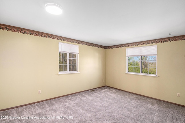 1626 Pepper Tree Ln Unit 13, Lansing, MI 48912 - carpeted empty room featuring baseboards