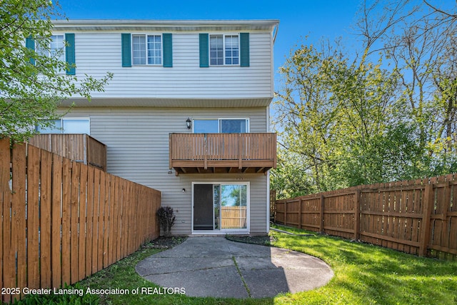 1626 Pepper Tree Ln Unit 13, Lansing, MI 48912 - back of house with a patio and a balcony