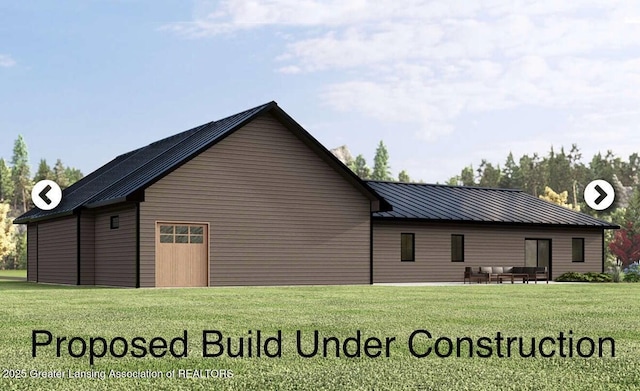 5895 Plains Rd, Eaton Rapids, MI 48827 - rear view of property with a lawn, metal roof, and an outdoor hangout area
