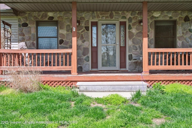 entrance to property with stone siding