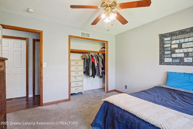 bedroom with carpet floors, baseboards, and a closet