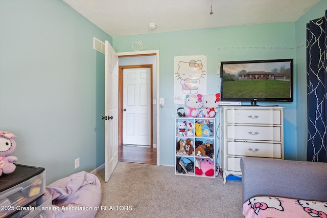 carpeted bedroom with baseboards
