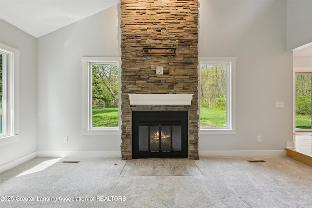 263 E Sherwood Rd, Williamston, MI 48895 - unfurnished living room featuring carpet, a fireplace, high vaulted ceiling, and baseboards