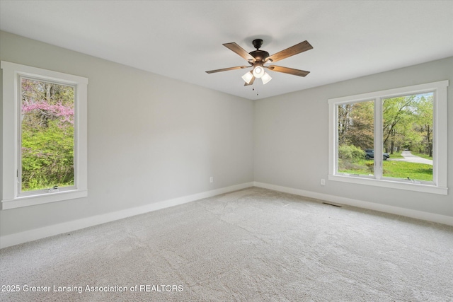 263 E Sherwood Rd, Williamston, MI 48895 - spare room featuring baseboards, carpet flooring, and ceiling fan