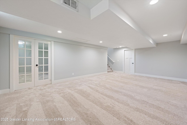 263 E Sherwood Rd, Williamston, MI 48895 - finished below grade area with french doors, carpet floors, recessed lighting, stairway, and baseboards
