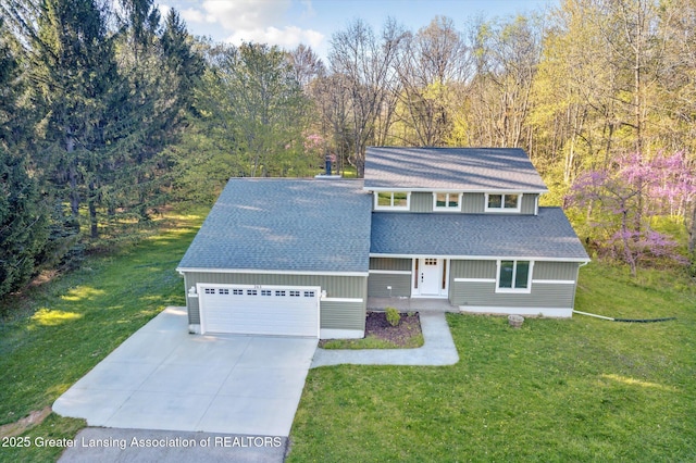 263 E Sherwood Rd, Williamston, MI 48895 - traditional-style house featuring a shingled roof, driveway, a front lawn, and a garage