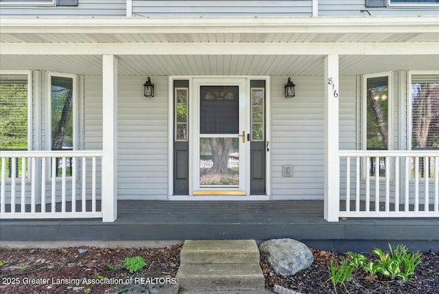 doorway to property with a porch