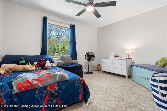 bedroom with carpet, a textured ceiling, and a ceiling fan
